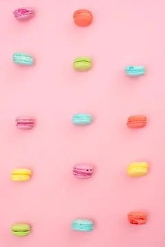 Multicolored macaroons on pink background Stock Photos