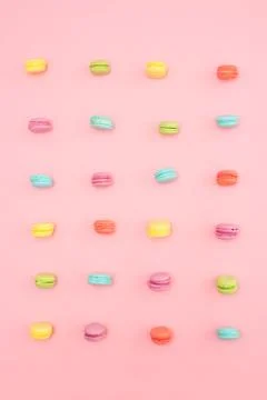Multicolored macaroons on pink background Stock Photos