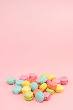 Multicolored macaroons on pink background Stock Photos
