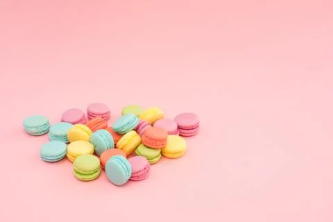 Multicolored macaroons on pink background Stock Photos