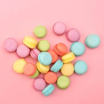 Multicolored macaroons on pink background Stock Photos