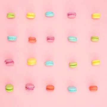 Multicolored macaroons on pink background Stock Photos