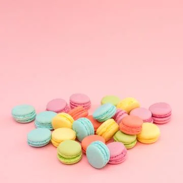 Multicolored macaroons on pink background Stock Photos