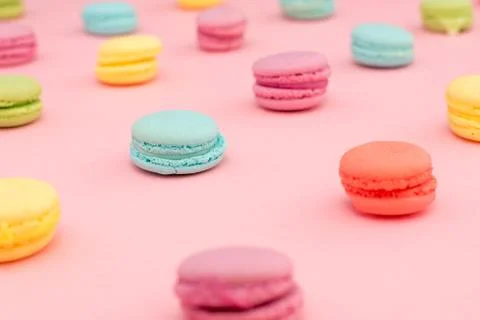 Multicolored macaroons on pink background Stock Photos
