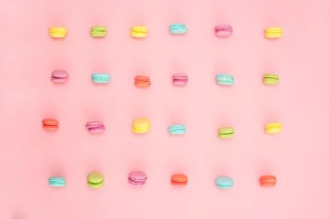 Multicolored macaroons on pink background Stock Photos