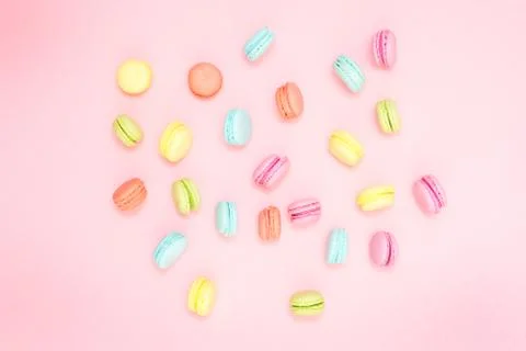 Multicolored macaroons on pink background Stock Photos