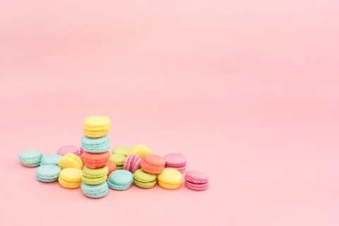 Multicolored macaroons on pink background Stock Photos