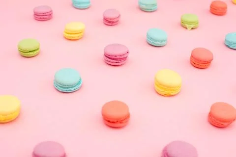 Multicolored macaroons on pink background Stock Photos