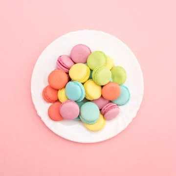 Multicolored macaroons on a plate Stock Photos