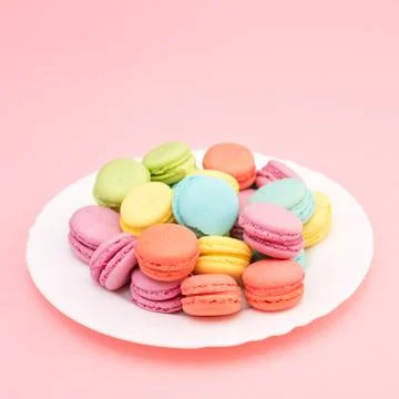 Multicolored macaroons on a plate Stock Photos