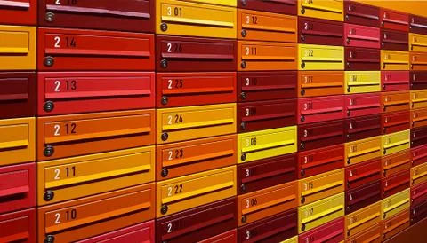 Multicolored mail boxes filled of numbers. Closed up Stock Photos