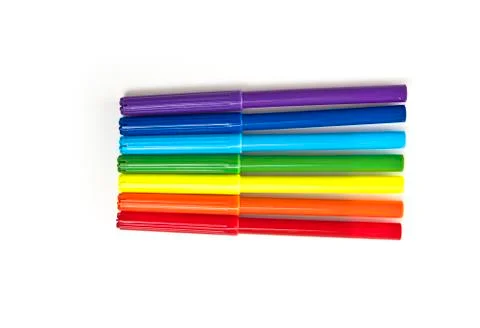 Multicolored markers on a white background top view Fotos de archivo