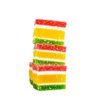 Multicolored marmalade in a stack on a white background Stock Photos