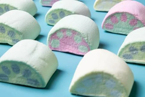 Multicolored marshmallows on a blue background Foto stock