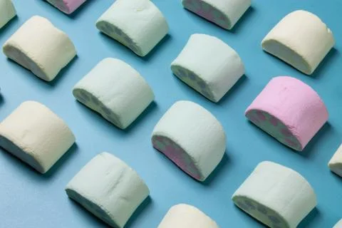 Multicolored marshmallows on a blue background Stock-Fotos