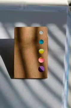 Multicolored notes in the office on the table Stock Photos