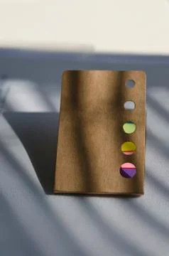 Multicolored notes in the office on the table Stock Photos