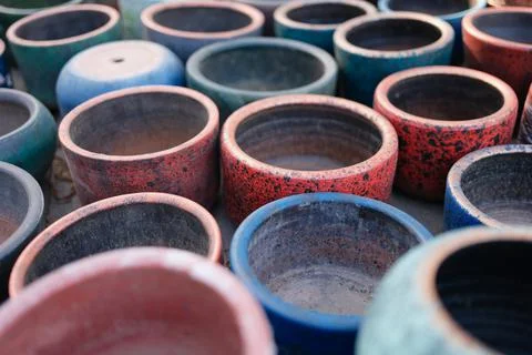 Multicolored old empty clay pots. Decorative ornament of ancient potter Stock Photos