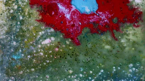 Multicolored paint bubbles and mixed. Video Stock Footage 123282702