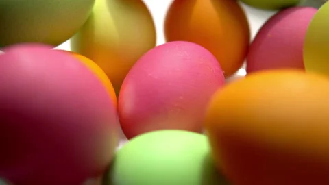 Multicolored painted chicken eggs lie in a plate for easter Stock Footage 153911542