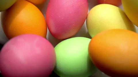 Multicolored painted chicken eggs lie in a plate for easter Stock Footage 153911765