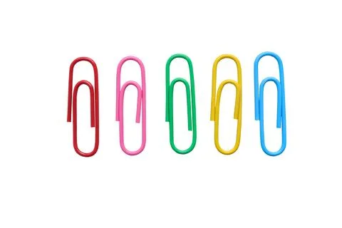 Multicolored paper clips on white background with clipping path.  Stock Photos