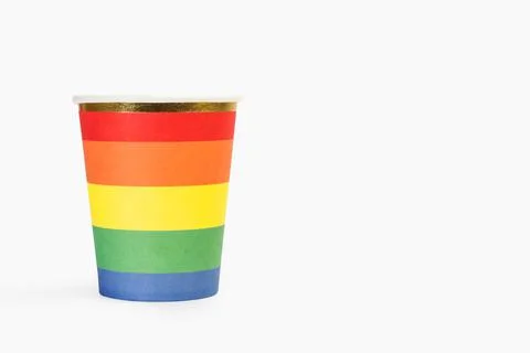 Multicolored paper cup on a white background Stock Photos