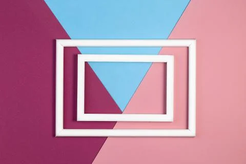 Multicolored paper with empty picture frame. flat layout with copy space. Stock Photos