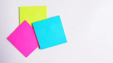 Multicolored paper for notes on a white background with place for text Stock-Fotos
