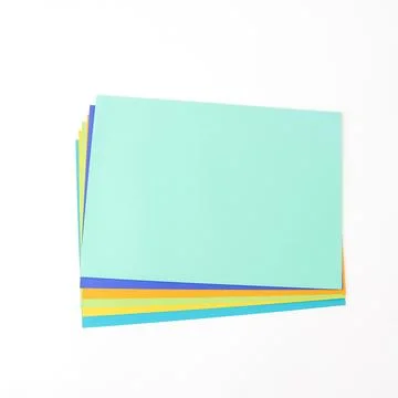 Multicolored paper on a white background. Flat lay, top view. There is spac.. Stock Photos