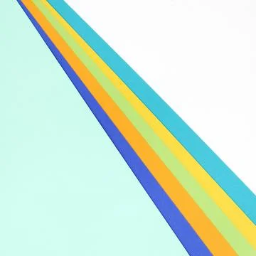 Multicolored paper on a white background. Flat lay, top view. There is space for Stock Photos