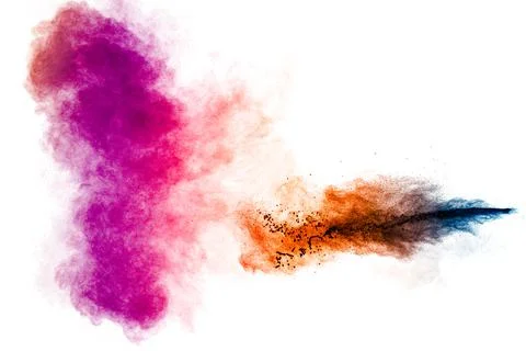 Multicolored particle exploding on white background. Colorful dust splashing. Stock Photos