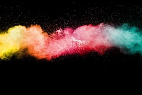 Multicolored particles explosion on white background. Colorful dust splatter. Stock Photos