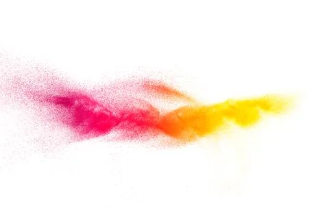 Multicolored particles explosion on white background. Colorful dust splatter. Stock Photos