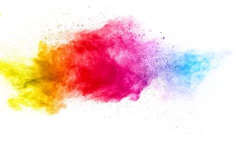 Multicolored particles explosion on white background. Colorful dust splatter. Stock Photos