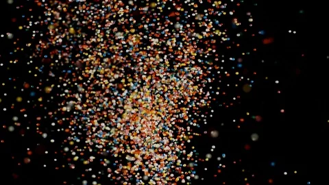 Multicolored particles flying, colorful rainbow sprinkles bouncing black Stock Footage 106732796