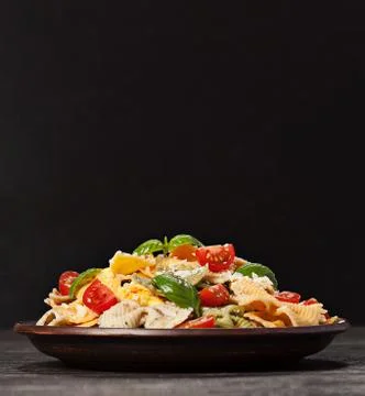 Multicolored pasta on dark background Stock Photos
