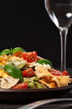 Multicolored pasta on dark background Stock Photos