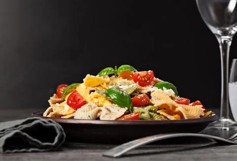Multicolored pasta on dark background Stock Photos