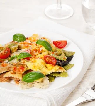 Multicolored pasta on light background Stock Photos