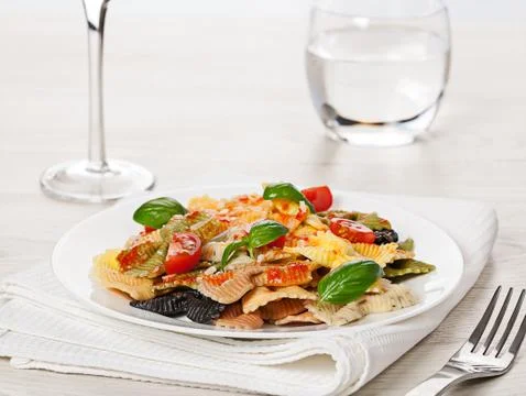 Multicolored pasta on light background Stock Photos