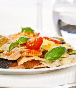 Multicolored pasta on light background Stock Photos