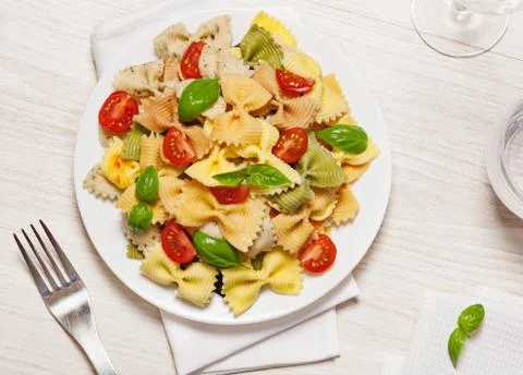 Multicolored pasta on light background Stock Photos