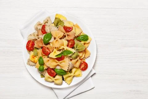Multicolored pasta on light background Stock Photos