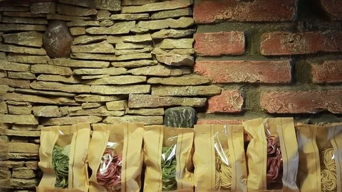 Multicolored pasta uncooked in a paper package Stock Footage 72755082