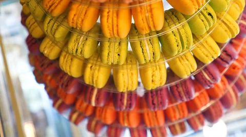 Multicolored pastries macarons multiple colors background Stock Photos