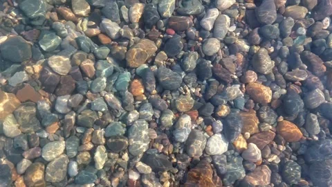 Multicolored pebble bottom of the Black Sea. Transparent water of the Black Sea. Stock Footage 283573594