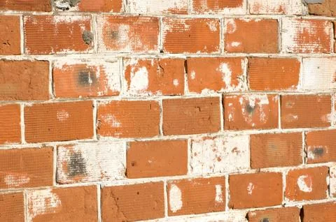 Multicolored peeling wall texture and background. Painted brickwork. Stock Photos
