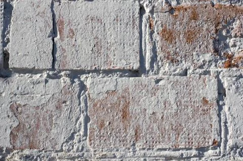 Multicolored peeling wall texture and background. Painted brickwork. Stock Photos