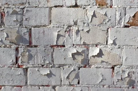Multicolored peeling wall texture and background. Painted brickwork. Stock Photos
